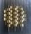 Striking mid-century modern Brutalist wall sculpture crafted in brass, featuring a rhythmic arrangement of geometric...