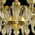 Elegant chandelier in transparent and gold Murano glass and gold metal frame. For classical and modern interiors, a piece...