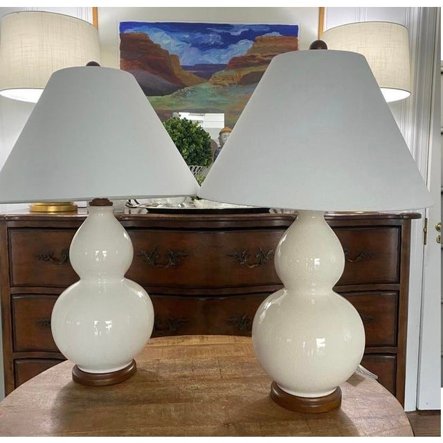 Absolutely lovely and classic pair of Ralph Lauren double gord lamps in creamy off white with a crackle glaze finish....