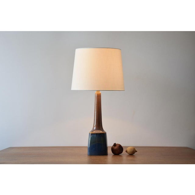 Tall ceramic table lamp from Søholm Stentøj, Denmark. Made circa 1960s. Beautiful shift in glaze colors from caramel brown...