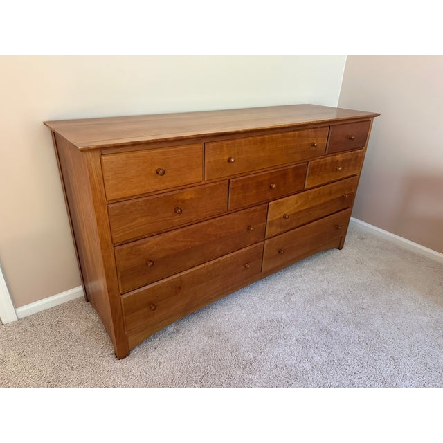 Beautiful cherry master bedroom set from Harden featuring queen-size bed frame, 11 drawer horizontal dresser, 9 drawer...