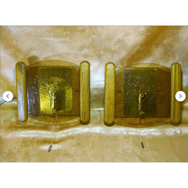 A sensational set of wall sconces, by legendary "Fischer Leuchten -Germany". Artfully realized in red oak and brass,...