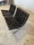 Incredible pair of classic Barcelona chairs by Mies Van Der Rohe for Knoll. This pair features perfectly patina'd black...