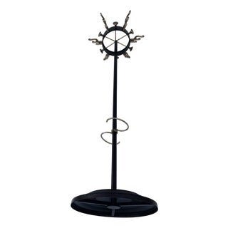 Mid-Century Modern Brass and Black Metal Coat Stand in the style Jacques Adnet, 1950s For Sale