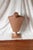 An Art Deco style male mannequin bust or in a pink or tan skin color. Possibly a vintage store display for shirts. Wood...