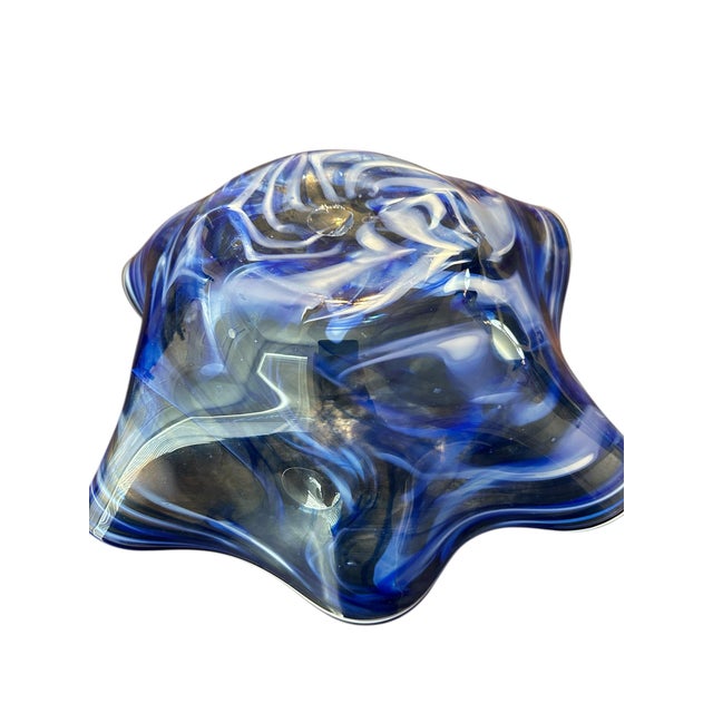 This stunning cobalt blue and white ruffled art glass bowl is perfect for any decor. The swirls and movement in this piece...