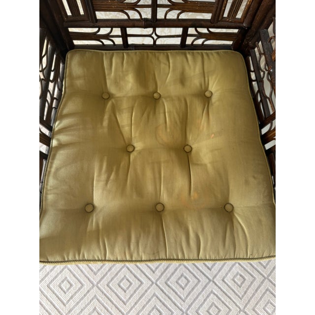 A Regency period Chinese export bamboo rattan armchair with cane seat and silk squab cushion similar to examples made for...