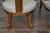 A pair of English style spoon back chairs from circa 1920 with low seats and curving legs resting on petite gilt spheres....