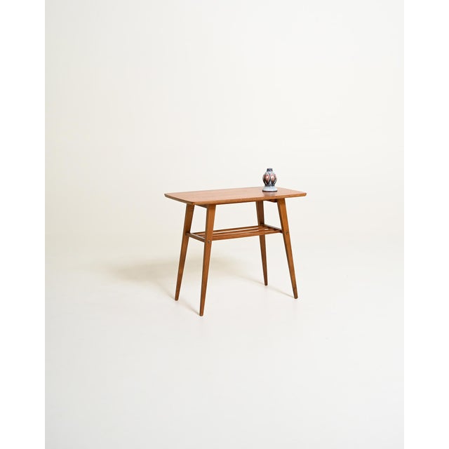 Teak frame with a rectangular top and a slatted lower magazine shelf. Scandinavian production, 1960s. Scandinavian-made...
