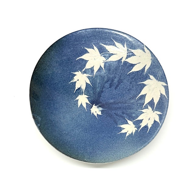 Blue ceramic bowl. This is a beautiful, large ceramic hand-made decorative bowl featuring a blue glaze with a cream maple...