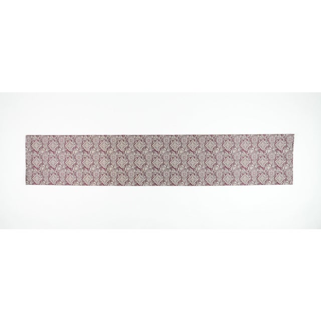 The damask of permanence. The classical floral medallion — woven structure rather than applied pattern — held here in...