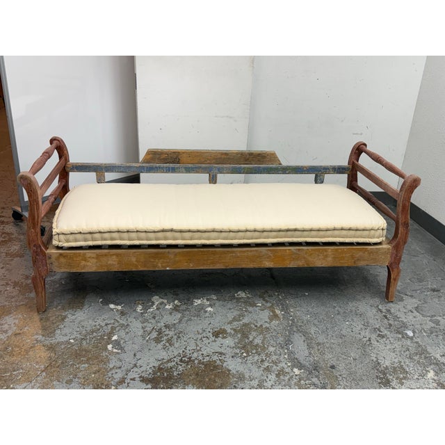 Design Plus Gallery presents a Vintage Rustic Wood Daybed Bench. This hand-painted wood frame with turned spindle side...