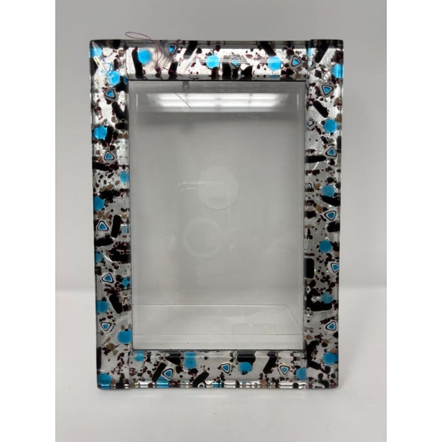Beautiful Murano Glass picture frame. Brand new. Created by one of the top Artists in Murano. Measures 9" x 6".