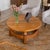 Stunning oak coffee table from France, 1950s. Solid oak circular table with arched stretchers connecting four block legs....