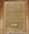 A signed Persian Tabriz mat in brown and orangem signed by weaver