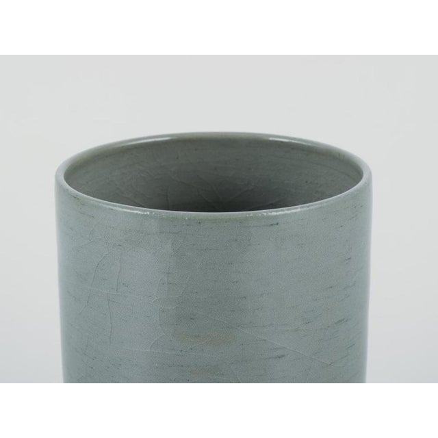 European studio ceramicist. Unique ceramic vase in a cylindrical shape. Glaze in blue-grey tones. Unglazed and glazed....