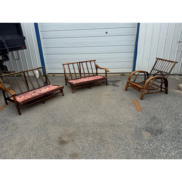 Offered for sale is a vintage Ficks Reed rattan seating group consisting of a two-piece modular sectional sofa and...