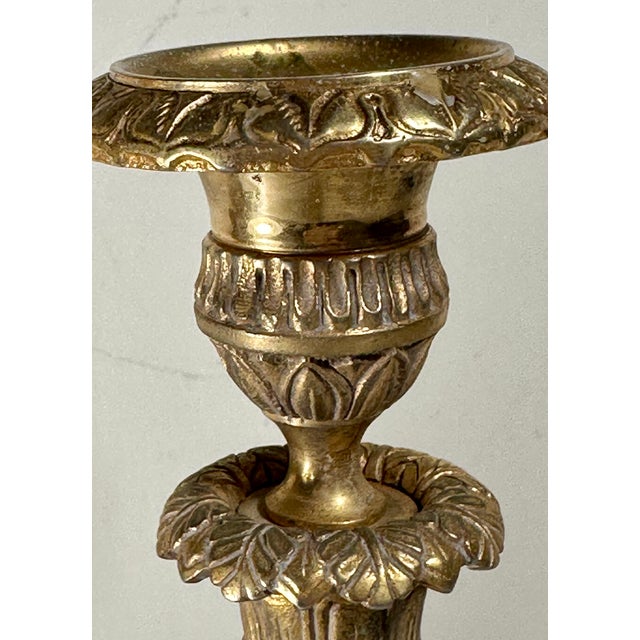 Antique Pair French Neoclassical Ormolu Bronze Candlesticks Elegant pair of 19th century French ormolu bronze single light...