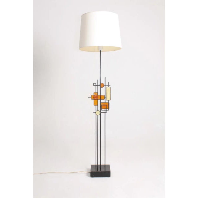 Floor lamp in metal and art glass on a wood base, designed and made by Svend Aage Holm Sorensen. Great original condition....