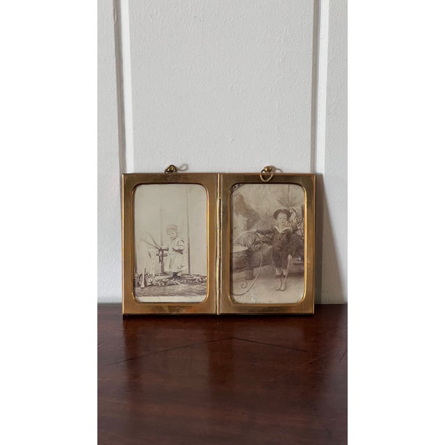 Antique French brass double mirror with timeless European character, featuring a warm aged patina and elegant folding...