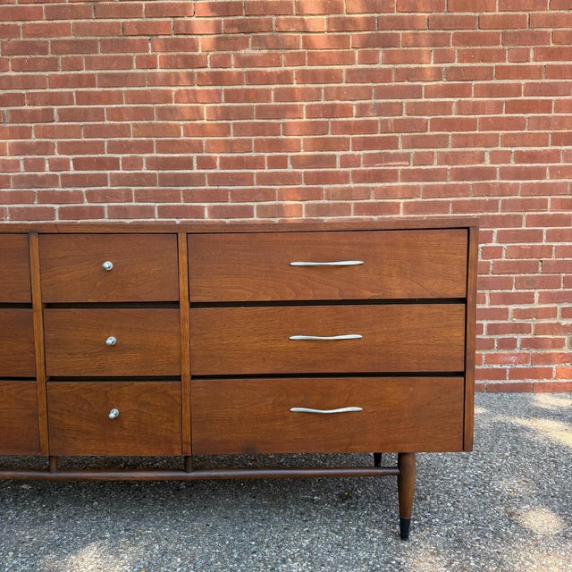 Designed by Andre Bus for Lane’s iconic Acclaim collection, this walnut lowboy dresser showcases the line’s signature...