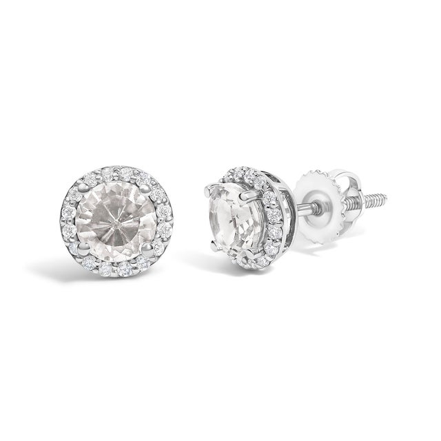 Immerse yourself in the allure of these exquisite 10K white gold stud earrings, each centered with a captivating 5mm...