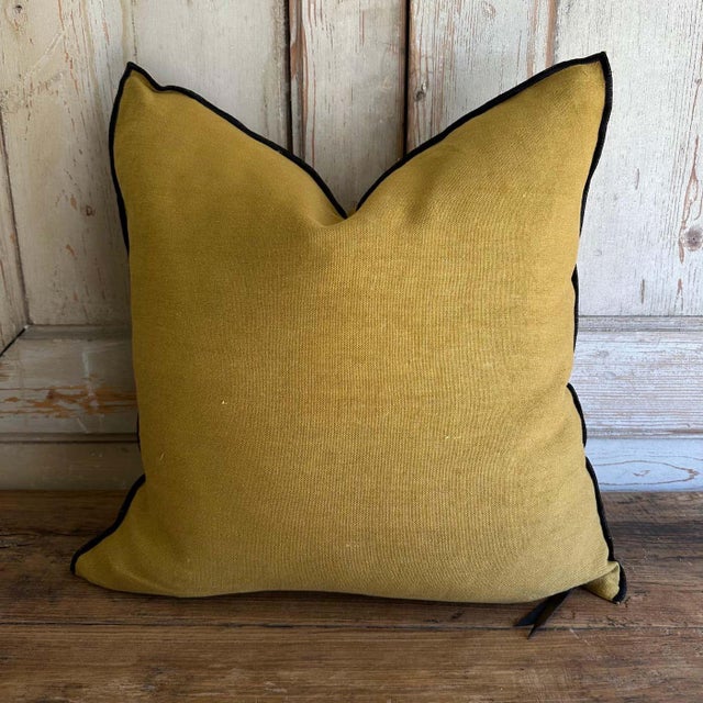 Color: Ocre; a deeper mustard yellow with brown tones, linen textured style pillow with a stitched edge, metal zipper...