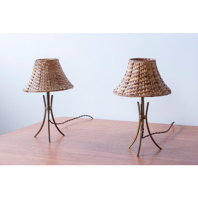Pair of table lamps designed and made in Sweden during the 1940-50s. Made from solid brass standing on a neat tripod base...