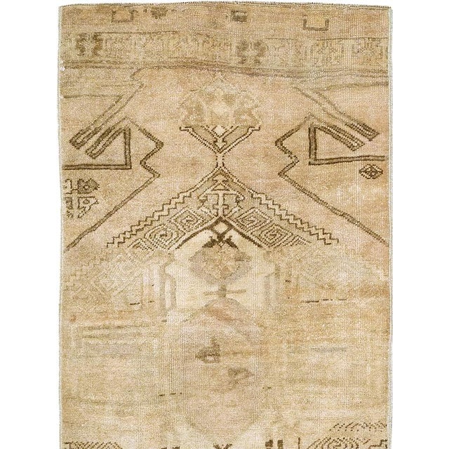 This mid-20th-century Turkish Anatolian runner presents a bold, abstract composition organized around large angular...