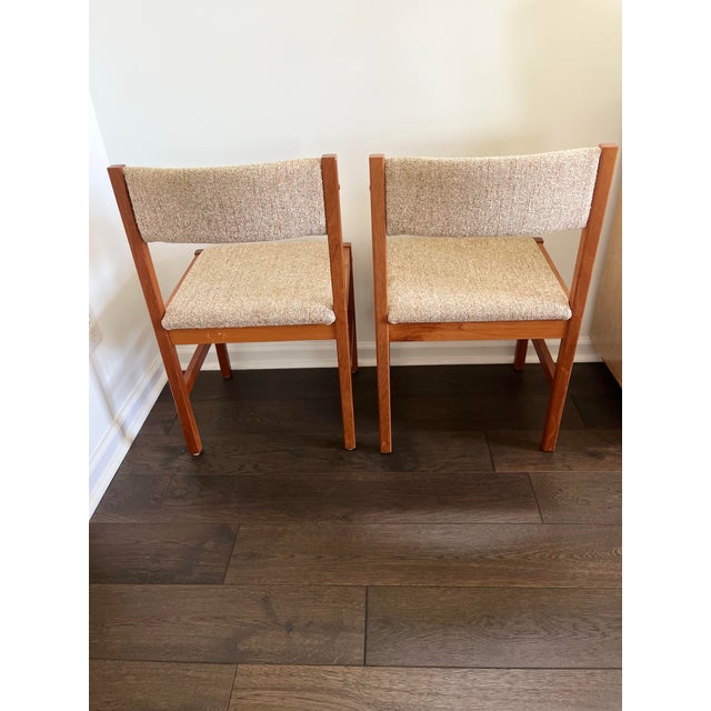 Elevate your space with this handsome pair of authentic vintage 1970s Mid-Century Danish Modern dining chairs,...