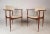 This stunning pair of vintage modern chairs feature sculpted arm rests, a floating style backrest, and tapered legs. The...