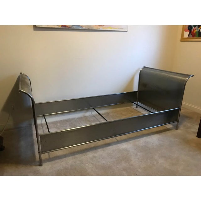Beautiful vintage steel bed. Gracefully sloping head and foot boards. Sturdy and strong with 8 large screws that hold bed...