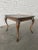 This mahogany cocktail table is the perfect size as a drink or occasional table. near square tray top on four curved legs...