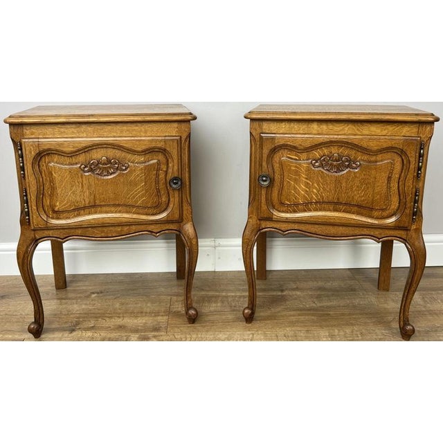 This elegant pair of Vintage French Louis bedside tables combines classic French styling with practical storage and...
