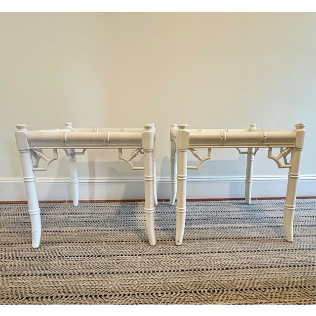 Charming pair of vintage faux bamboo side tables featuring removable inset glass tops and decorative fretwork detailing....