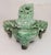 This is a vintage Chinese Jade covered incense burner with tripod feet, Foo Dog finial and Dragon Head loose ring handles....