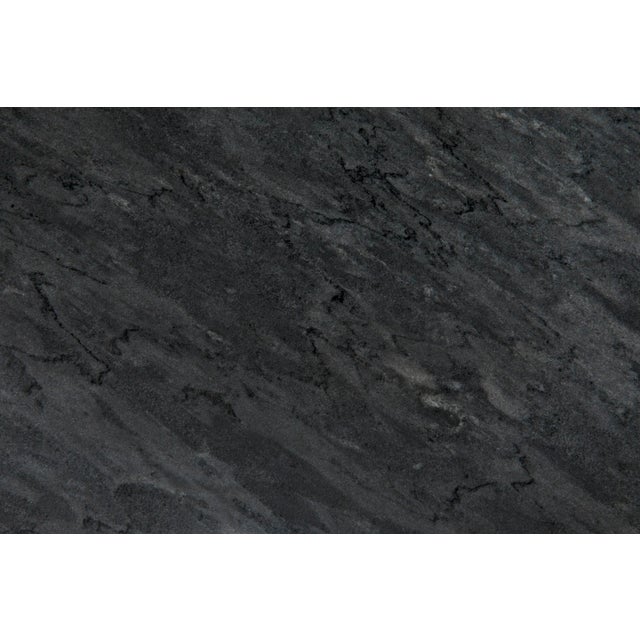 Sleek and very unique, the lines of this walnut console table are formed from nine hand-carved boxes, seemingly...