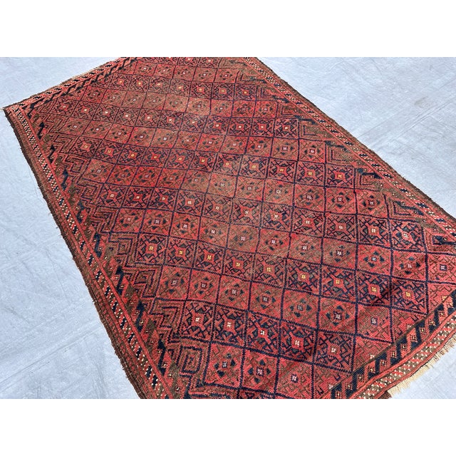 A genuine antique Yomut Turkmen tribal rug featuring the classic all-over diamond lattice field — hundreds of interlocking...