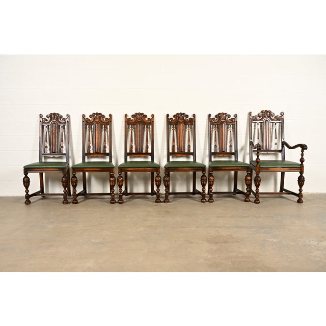 A beautiful set of six antique English Jacobean or Tudor style dining chairs By Berkey & Gay USA, Circa 1920s Carved...