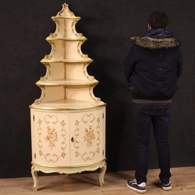 Italian corner cabinet from 20th century. Furniture of beautiful line in lacquered, gilded and hand-painted wood with very...