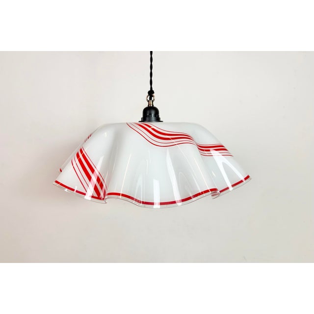 Vintage milk glass ceiling light made in former Czechoslovakia during the 1970s. The bakelite socket requires standard...