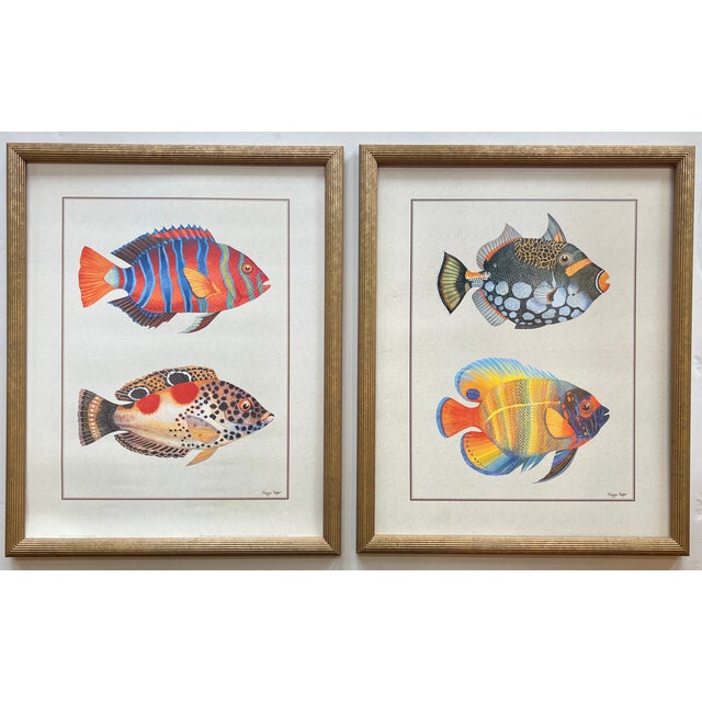 A pair of vintage lithographs by Maggie Riegler from her vibrant and colorful tropical fish series. Each print measures...