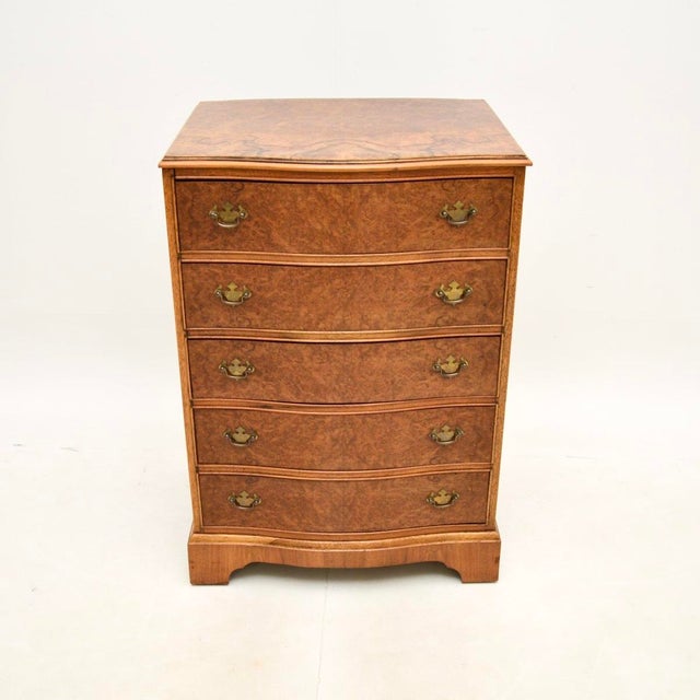A stunning antique serpentine burr walnut chest of drawers in the Georgian style. This was made in England, it dates from...