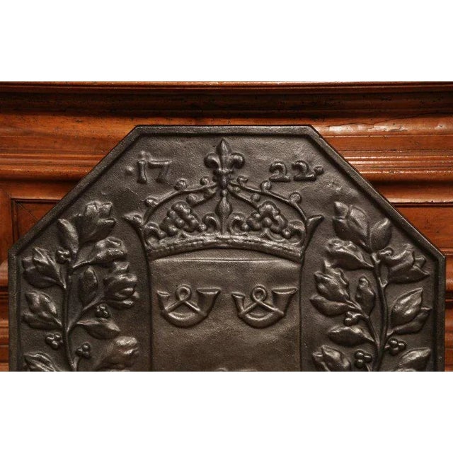 Rich in heraldic detail and architectural presence, this substantial antique French fireback would make a striking focal...