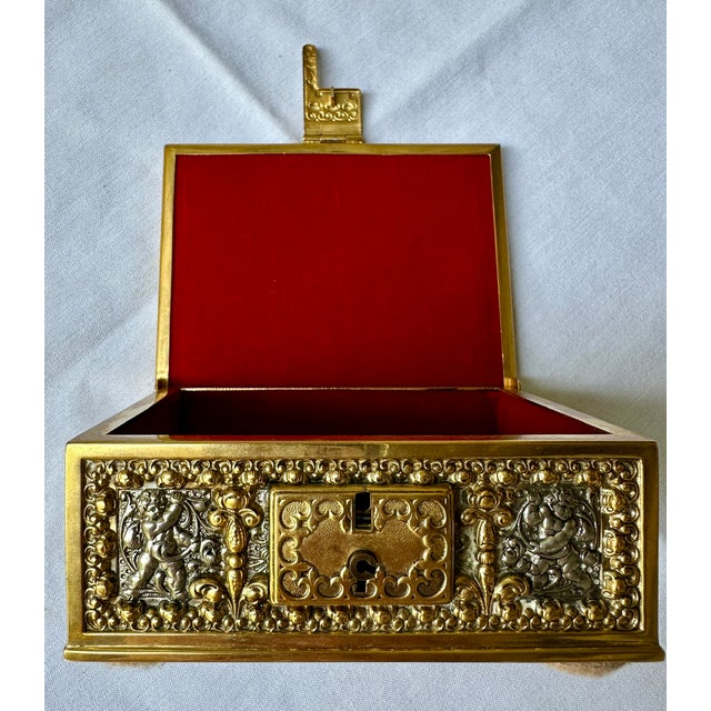 Antique Erhard & Söhne German Gilt Brass Jewelry Casket with Cherubs, Early 20th Century A beautifully detailed antique...