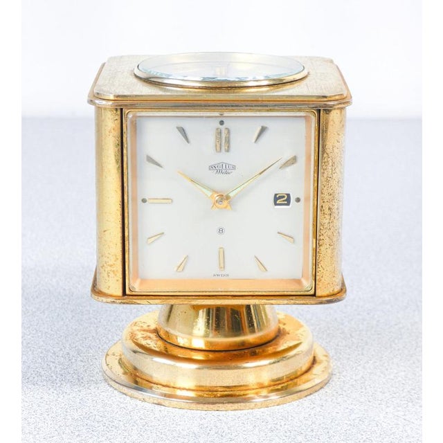Angelus meteo table clock with date, thermometer, hygrometer, barometer and compass. Manual winding 8-day. Switzerland,...