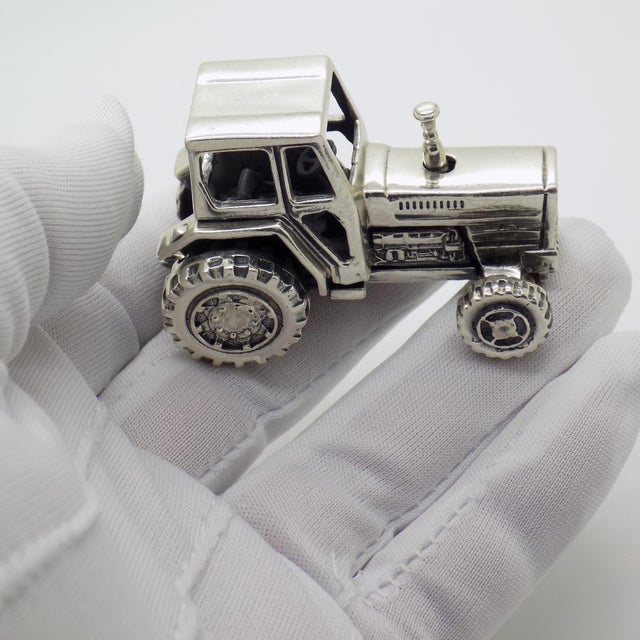 A handmade Italian tractor figurine from the 1980s/1990s, crafted in Sterling Silver and hallmarked 925 which stands for...