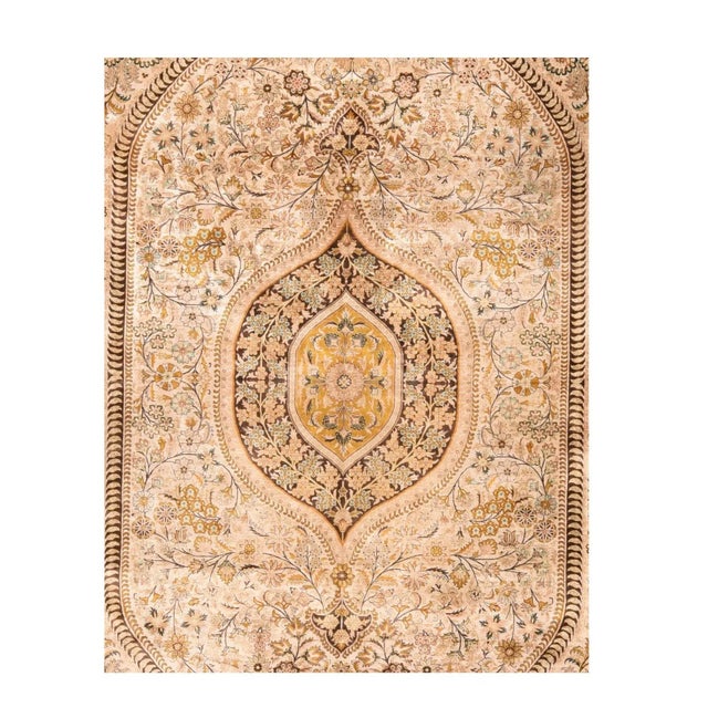 This relatively modern all silk central Persian workshop piece shows a palette of pale green, ecru and goldenrod, in a...
