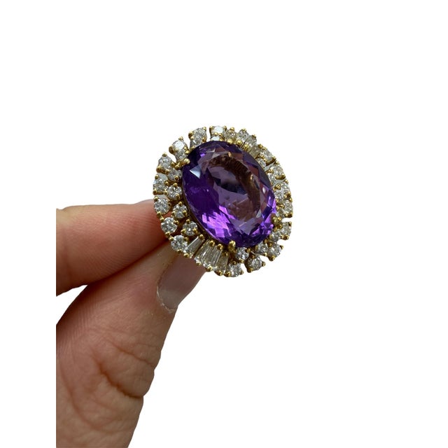 This absolutely stunning ring, boasts a gorgeous 10.00 carat treated amethyst and measures 17.20 x 13.00 x 7.85 mm....