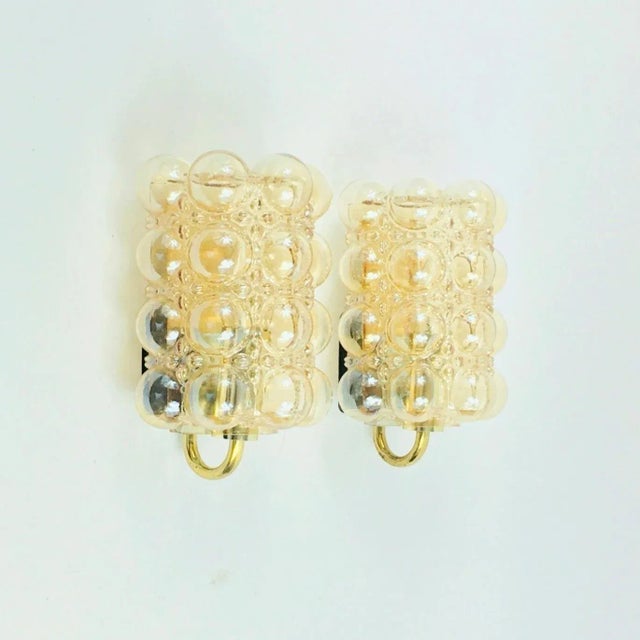 Stunning pair of amber bubble glass wall lights/sconces designed by helena tynell for limburg, one of germany's leading...